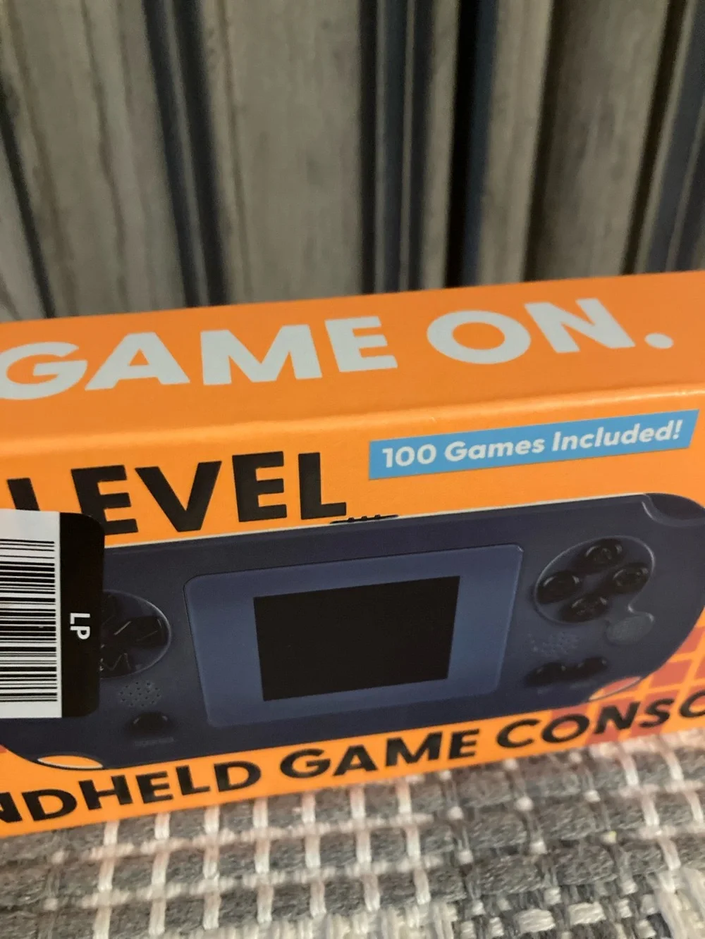 Next Level Apparel Handheld Game Console - Orange Box, Blue Device
